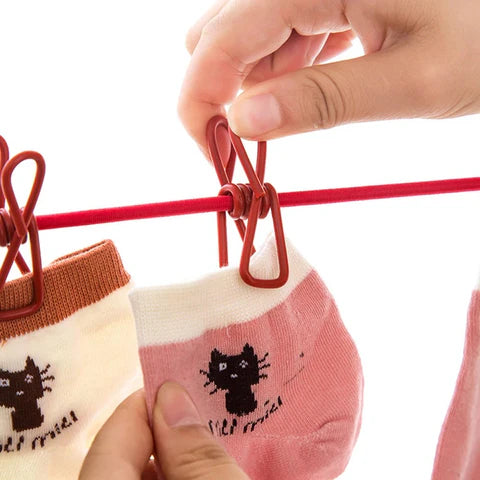  Corde à linge élastique avec 12 pinces – L’alliée parfaite des foyers marocains cet hiver !