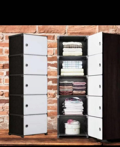 Armoire de rangement 5 tiroirs plastique noir et blanc, modulable et assemblable sans outils.